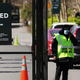 A guard stands at the entrance to the Bronx Zoo on April 6, 2020 in New York City. A tiger at the zoo tested positive for covid-19, the Wildlife Conservation Society said.